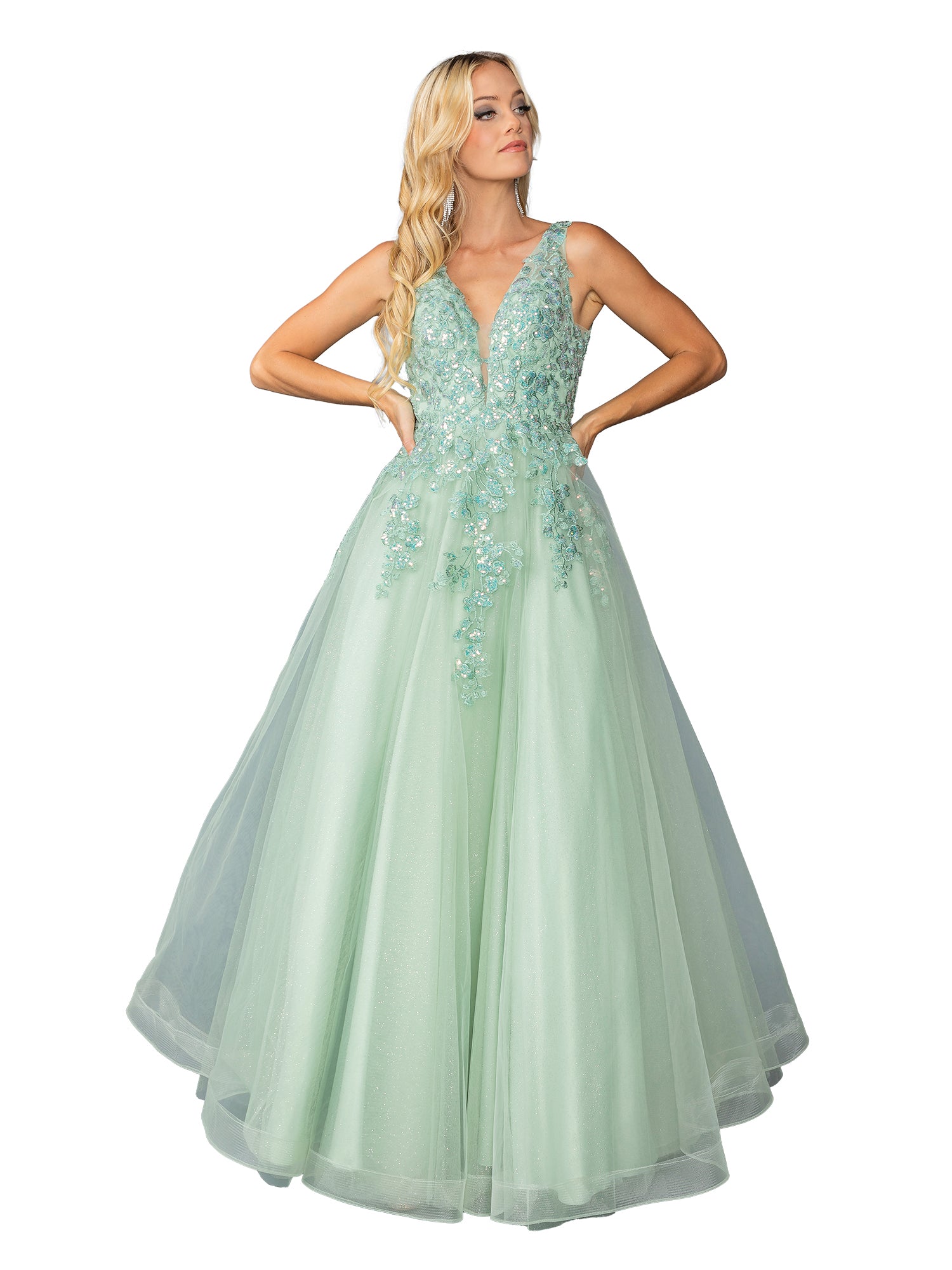 A woman poses with hands on hips in the Dancing Queen 4430 pastel long prom ball gown, featuring floral appliqué details and a deep V neckline.